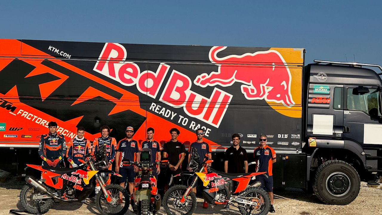 Red Bull KTM Factory Racing team with their bikes in front of the team truck